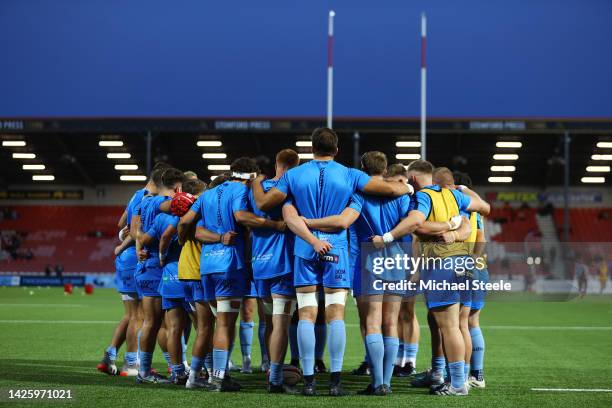 Worcester Warriors players huddle on pitch ahead of warm ups prior to the Premiership Rugby Cup match between Gloucester and Worcester Warriors at...