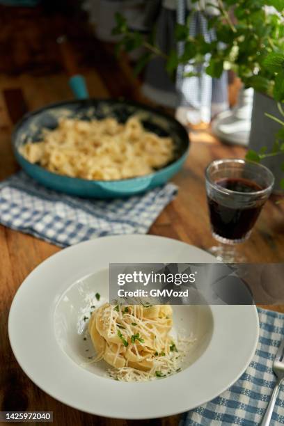 fettuccine pasta alfredo with parmesan - fettuccine stock pictures, royalty-free photos & images