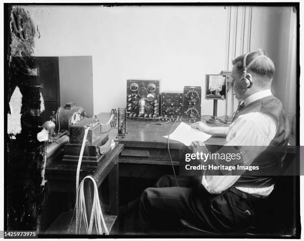 Radio, between 1910 and 1920. Ticker tape machine, USA. Artist Harris & Ewing.