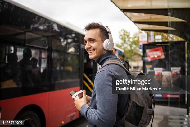 student at the bus station - waiting bus stock pictures, royalty-free photos & images