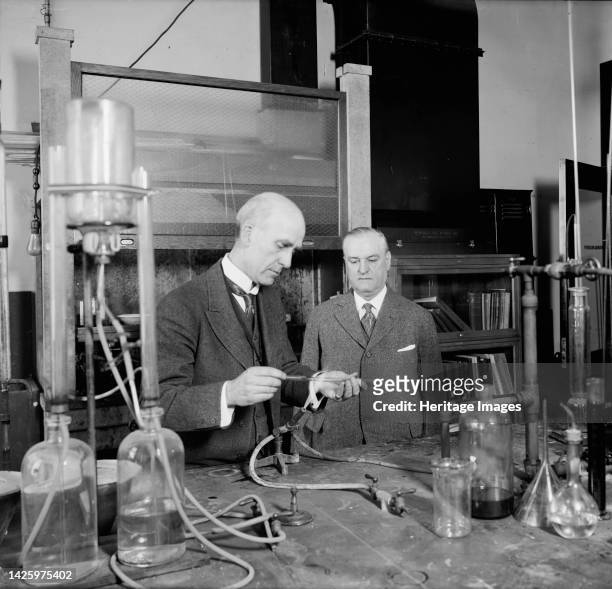 Interior Dept. - Bureau of Mines, [Washington, DC], between 1910 and 1920. Scientist using a bunsen burner to heat a glass instrument. The United...