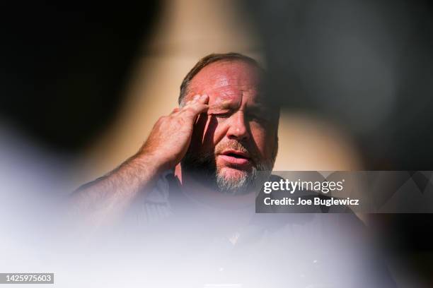 InfoWars founder Alex Jones speaks to the media outside Waterbury Superior Court during his trial on September 21, 2022 in Waterbury, Connecticut....