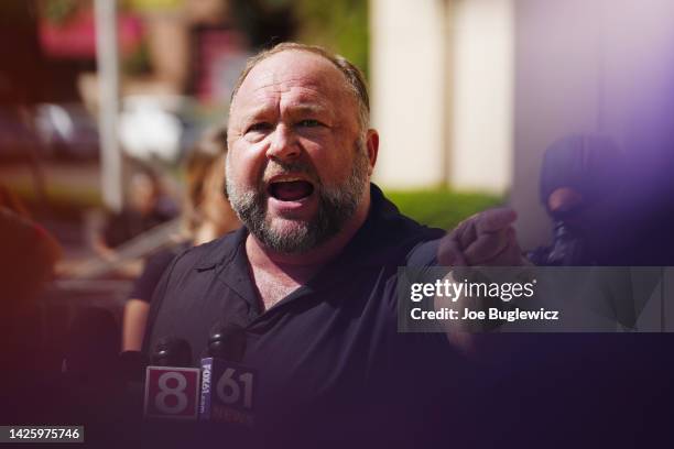 InfoWars founder Alex Jones speaks to the media outside Waterbury Superior Court during his trial on September 21, 2022 in Waterbury, Connecticut....