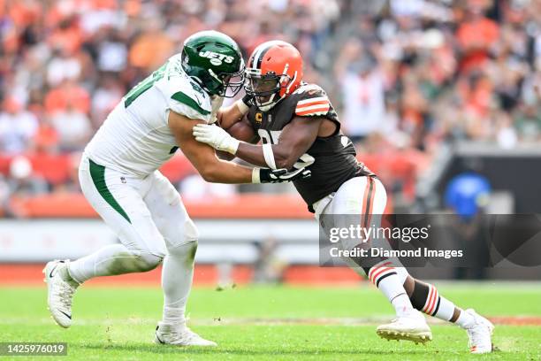 Myles Garrett of the Cleveland Browns rushes against Max Mitchell of the New York Jets during the second half at FirstEnergy Stadium on September 18,...