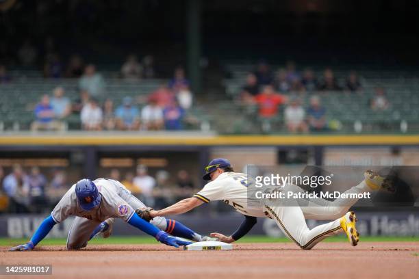 Brandon Nimmo of the New York Mets steals second base against Willy Adames of the Milwaukee Brewers in the first inning during a game at American...