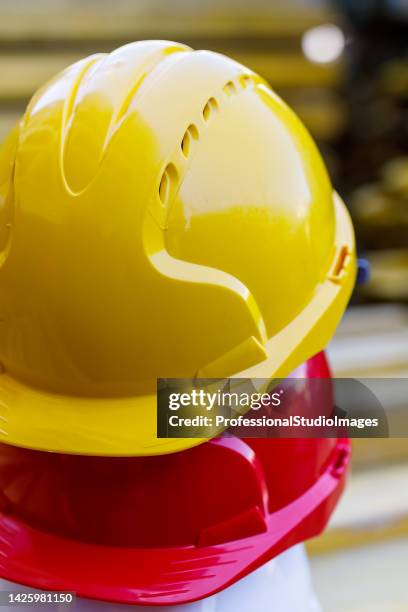 protective helmets at the construction site. - workers compensation stock pictures, royalty-free photos & images