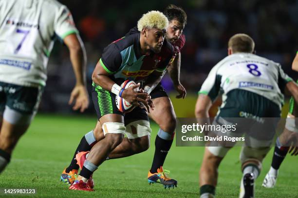 Viliami Taulani of Harlequins runs with the ball during the Premiership Rugby Cup match between Harlequins and London Irish at The Stoop on September...