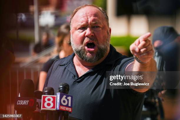 InfoWars founder Alex Jones speaks to the media outside Waterbury Superior Court during his trial on September 21, 2022 in Waterbury, Connecticut....