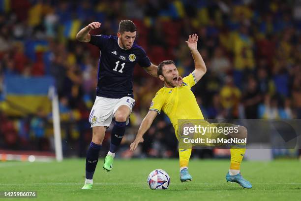 Ryan Christie of Scotland and Oleksandr Karavaev of Ukraine battle for the ball during the UEFA Nations League League B Group 1 match between...
