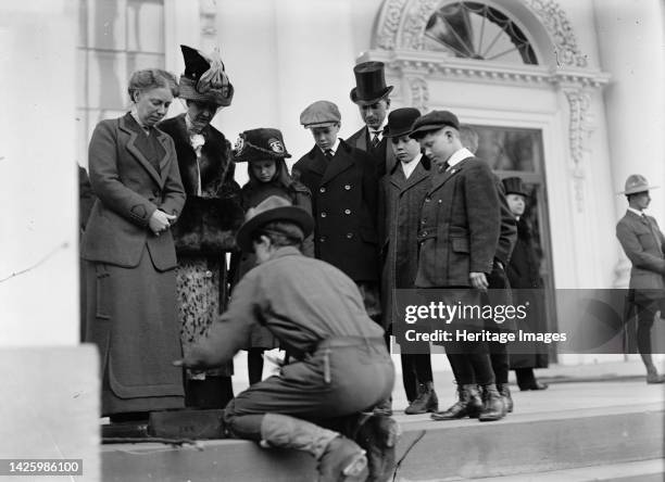 Boy Scouts - Visit of Sir Robert Baden-Powell To [Washington] D.C. Making Fire; Mrs. Taft Watching, 1911. [First Lady Helen Herron Taft observes...