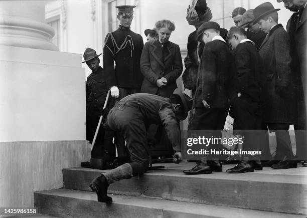 Boy Scouts - Visit of Sir Robert Baden-Powell To [Washington] D.C. Making Fire; Mrs. Taft Watching, 1911. [First Lady Helen Herron Taft observes...