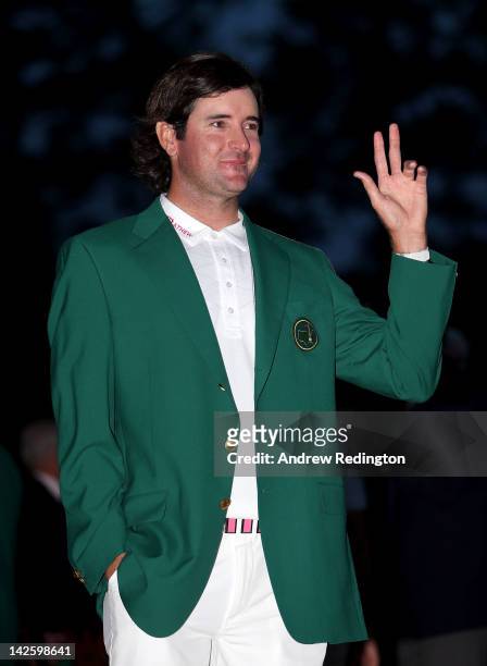 Bubba Watson of the United States gestures after his one-stroke playoff victory to win the 2012 Masters Tournament during the green jacket...