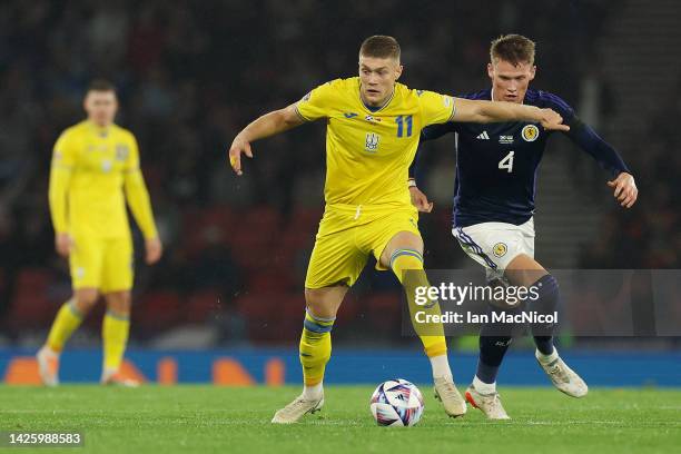 Artem Dovbyk of Ukraine holds the ball whilst under pressure from Scott McTominay of Scotland during the UEFA Nations League League B Group 1 match...