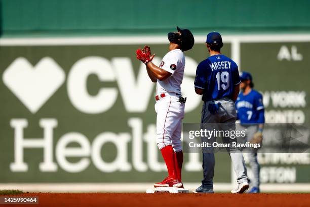 Xander Bogaerts of the Boston Red Sox reacts after hitting an RBI double in the bottom of the first inning of the game against the Kansas City Royals...