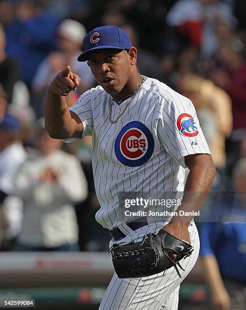 Carlos Marmol of the Chicago Cubs celebrates a save against the Washington Nationals at Wrigley Field on April 8, 2012 in Chicago, Illinois. The Cubs...