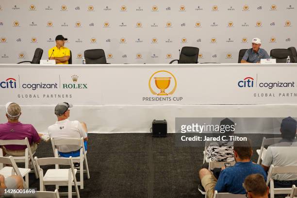 Captain Trevor Immelman of the International Team and Captain Davis Love III of the United States Team look on during the Captains' Pairings press...