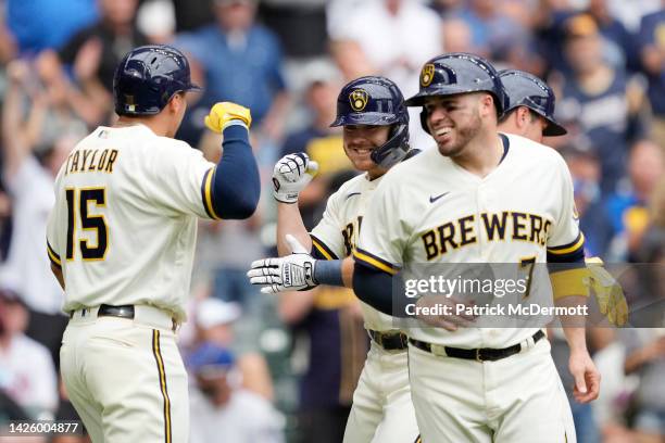 Mike Brosseau of the Milwaukee Brewers celebrates with his teammates at home plate after hitting a grand slam against the New York Mets in the...