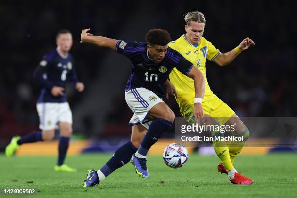Che Adams of Scotland and Mykhailo Mudryk of Ukraine battle for the ball during the UEFA Nations League League B Group 1 match between Scotland and...