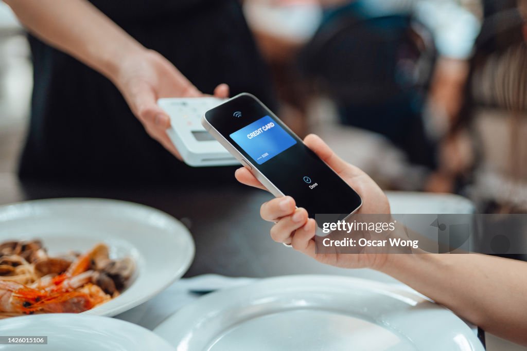 Making contactless payment with smart phone in restaurant