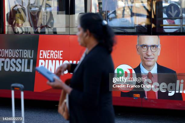 An election poster showing Enrico Letta, leader of the 'Partito Democratico' , with the slogan Choose! is depicted on a public transport bus on...