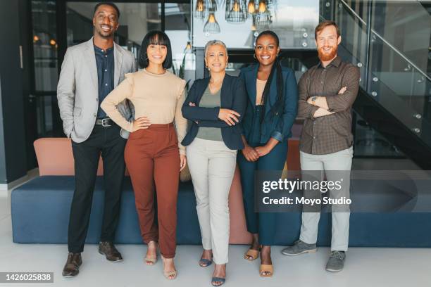 portrait of a creative, business and marketing team and manager standing in the company lobby. diversity, professional and corporate group of employees at a management workshop in the office building - about us stock pictures, royalty-free photos & images