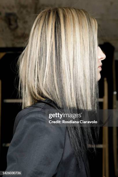 Model, hair detail, poses backstage at the AC9 Fashion Show during the Milan Fashion Week Womenswear Spring/Summer 2023 on September 21, 2022 in...