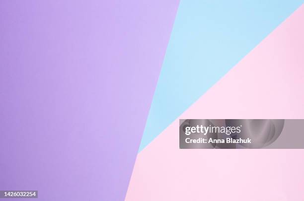 diagonal geometric paper background in different shades of purple, pink and blue - pastel background stock pictures, royalty-free photos & images