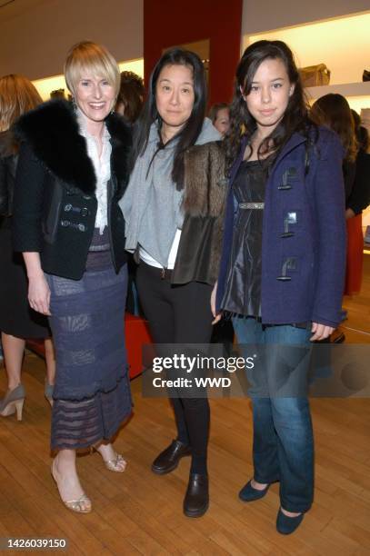 Amy Astley, Vera Wang and Cecilia Becker attend Teen Vogue and Victoria Traina's holiday shopping event at Hogan Spring Street.