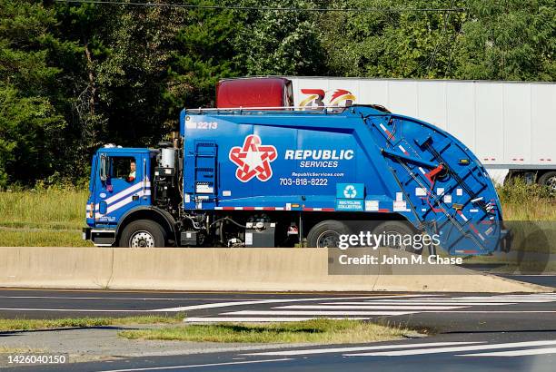 republic services garbage truck - garbage truck driving stock pictures, royalty-free photos & images