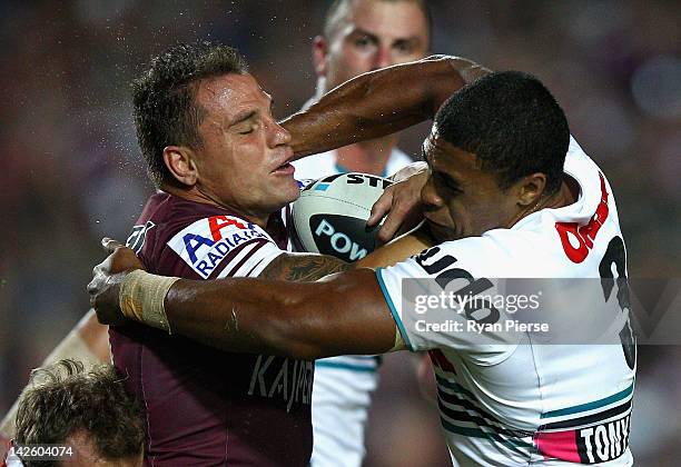 Anthony Watmough of the Sea Eagles is tackled by Michael Jennings of the Panthers during the round six NRL match between the Manly Sea Eagles and the...