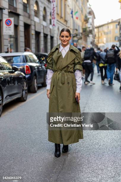 Olivia Palermo wears khaki belted trench coat, white button shirt outside Alberta Ferretti during the Milan Fashion Week - Womenswear Spring/Summer...