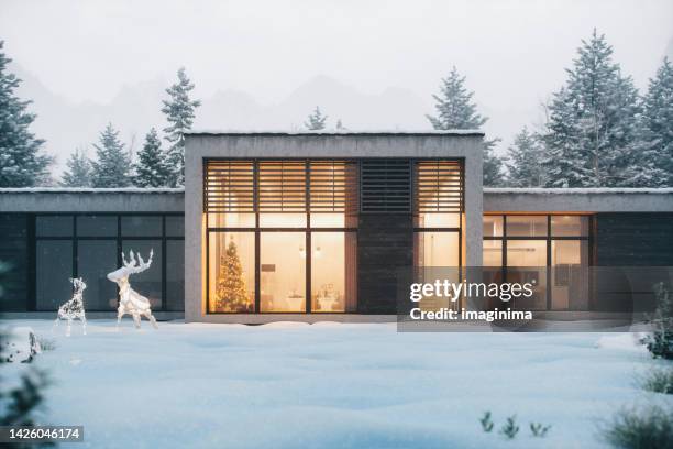 christmas night at the chalet - modern house dusk stock pictures, royalty-free photos & images