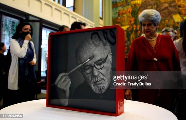 Woman observes at the book during the launch of "Via Crucis" an artistic book by Colombian painter and sculptor Fernando Botero on September 21, 2022...
