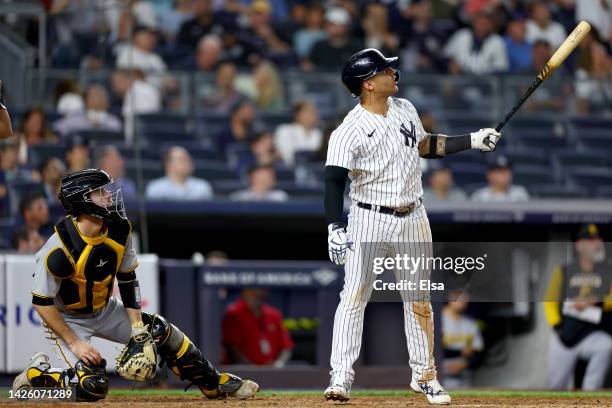 Gleyber Torres of the New York Yankees watches his home run in the eighth inning as Jason Delay of the Pittsburgh Pirates defends at Yankee Stadium...
