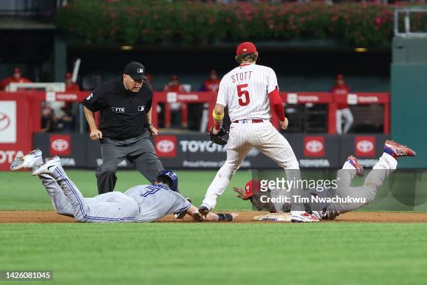 Jean Segura of the Philadelphia Phillies forces out Bradley Zimmer of the Toronto Blue Jays during the tenth inning at Citizens Bank Park on...