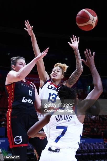 Kyara Linskens of Belgium is challenged by Shakira Austin and Ariel Atkins of the United States during the 2022 FIBA Women's Basketball World Cup...