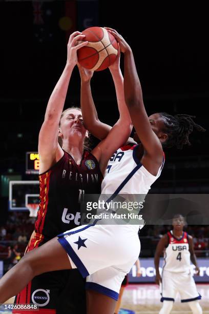Emma Meesseman of Belgium rand Ariel Atkins of the United States rebound during the 2022 FIBA Women's Basketball World Cup Group A match between USA...