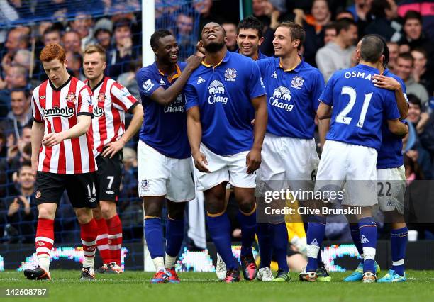 Victor Anichebe of Everton celebrates with his team mates after scoring his team's fourth goal during the Barclays Premier League match between...