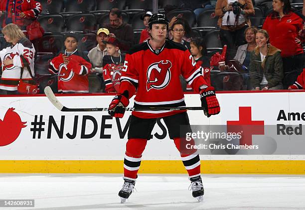 Cam Janssen of the New Jersey Devils looks on during warm ups against the Ottawa Senators at Prudential Center on April 7, 2012 in Newark, New...