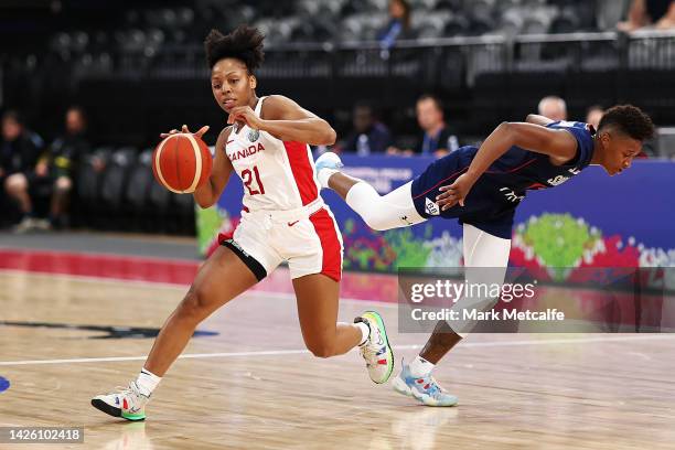 Nirra Fields of Canada evades the challenge of Yvonne Anderson of Serbia during the 2022 FIBA Women's Basketball World Cup Group B match between...