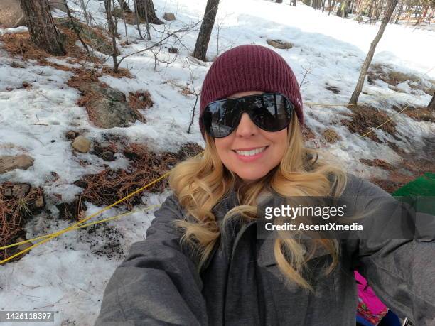 portrait of woman taking selfie in winter outfit - flagstaff arizona stock pictures, royalty-free photos & images