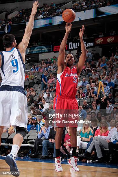 Trey Thompkins of the Los Angeles Clippers takes a jump shot against Yi Jianlian of the Dallas Mavericks on April 2, 2012 at the American Airlines...