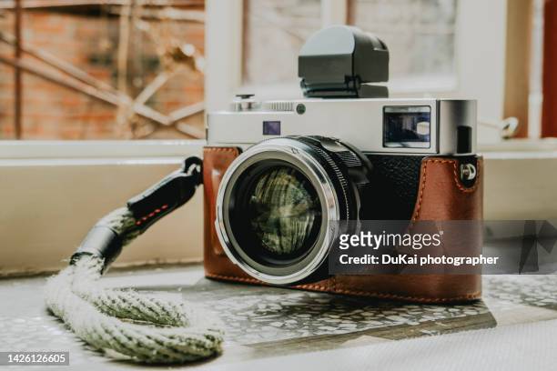 vintage cameras on window - photojournalist stock pictures, royalty-free photos & images