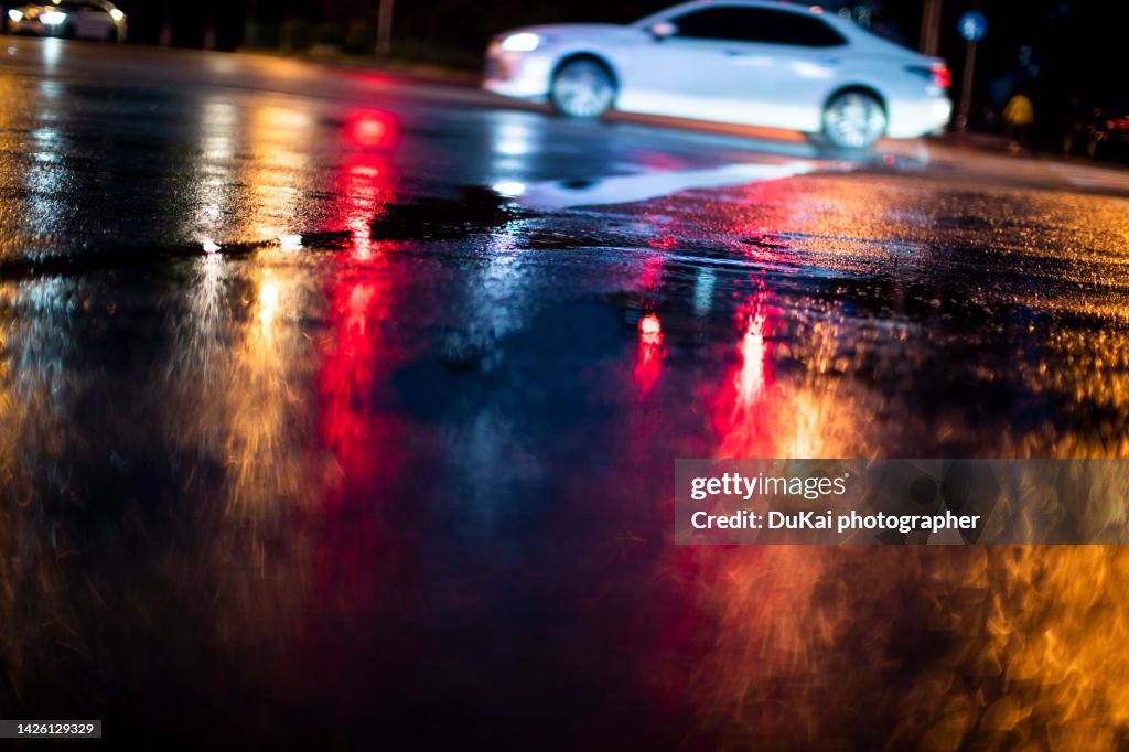 Streets after rain with reflections on wet asphalt in beijing