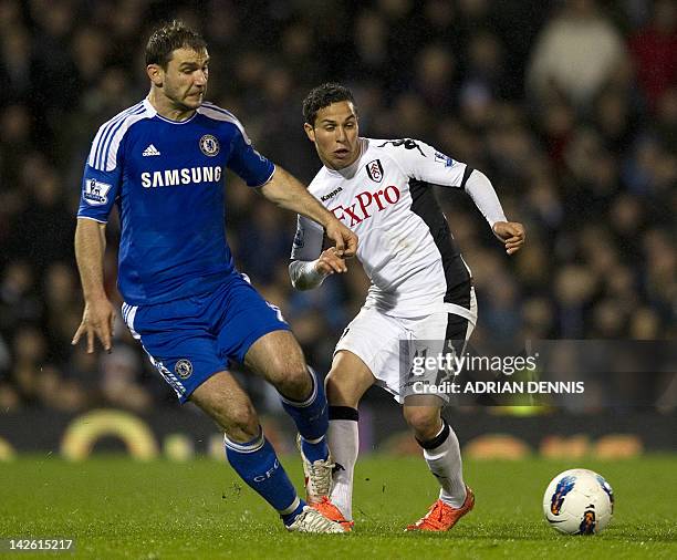 Chelsea's Serbian defender Branislav Ivanovic vies with Fulham's Austrian-Swiss midfielder Kerim Frei during the English Premier League football...