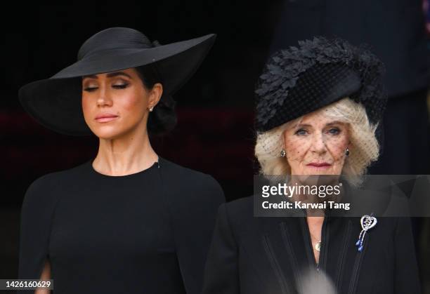 Meghan, Duchess of Sussex and Camilla, Queen Consort during the State Funeral of Queen Elizabeth II at Westminster Abbey on September 19, 2022 in...