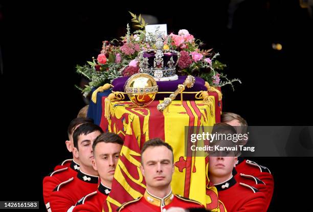 Queen Elizabeth's coffin is carried out of the doors of Westminster Abbey during The State Funeral Of Queen Elizabeth II at Westminster Abbey on...