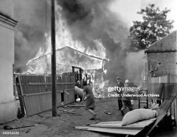 Shortly after Hitler's invasion of Poland, the German Luftwaffe rains incendiary bombs down on the Polish capitol of Warsaw, sending its citizens...