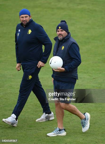 Durham coaches Neil Kileen and Stephen Harmison look on during the warm up prior to day three of the LV= Insurance County Championship match between...