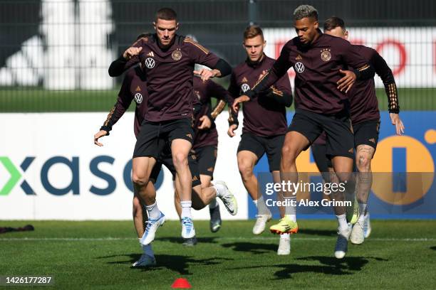 Robin Gosens and Lukas Nmecha exercise during a Germany training session at DFB-Campus on September 22, 2022 in Frankfurt am Main, Germany.